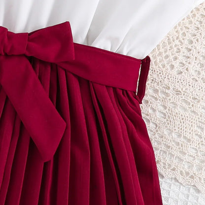 Elegantes Mädchenkleid mit Plisseerock