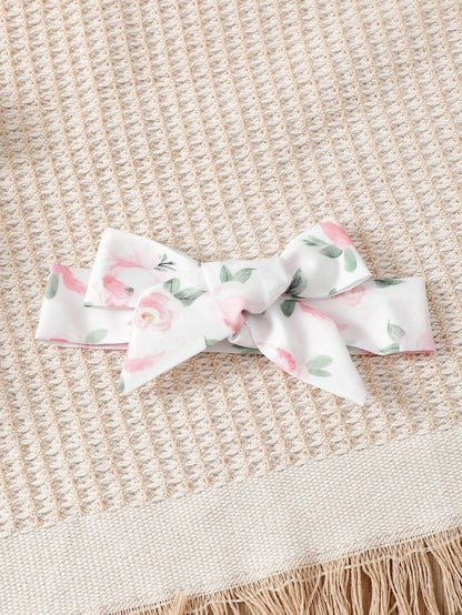 Zauberhaftes Baby-Kleid mit Blumenmuster und passendem Haarband